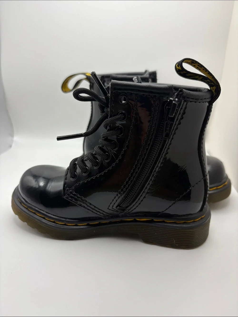 Dr. Martens Kids Glossy Black Patent Lace-Up Boots with Yellow Stitching